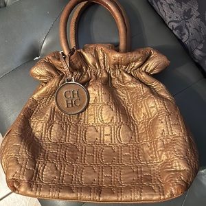 Carolina Herrera metallic gold monogram bucket bag